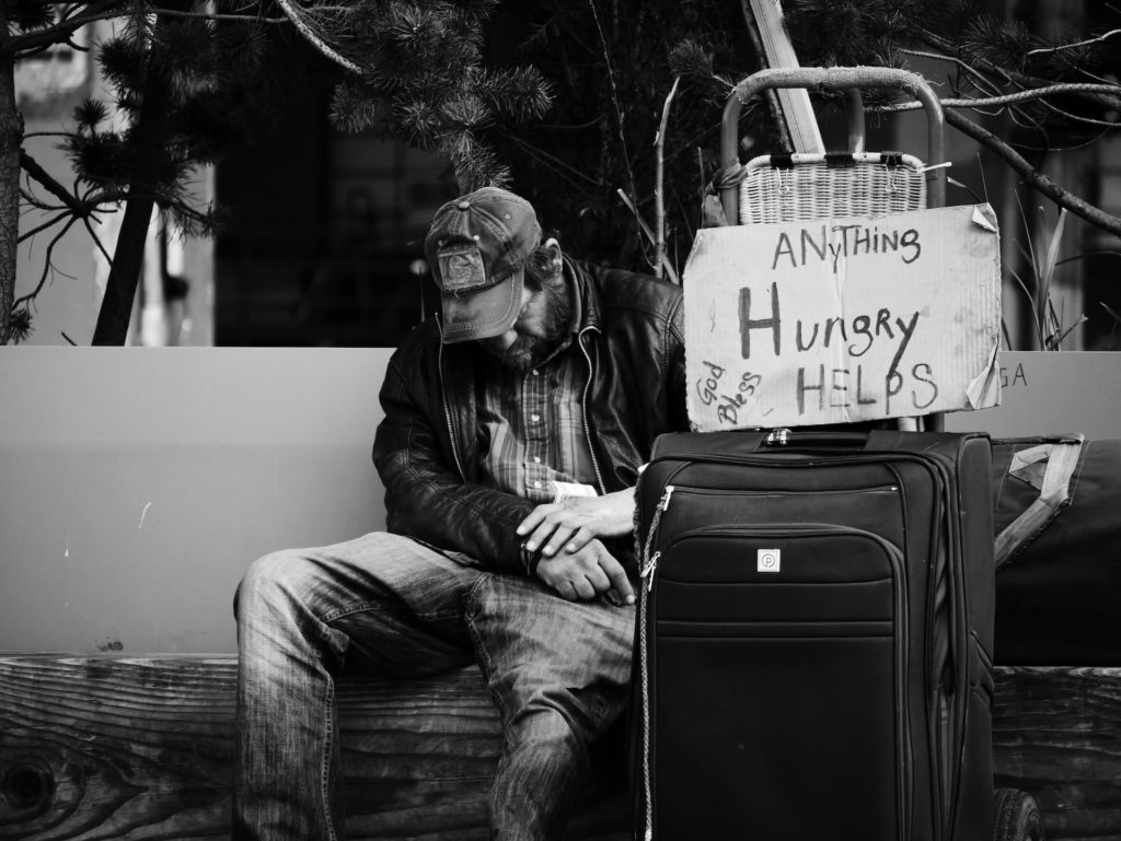A man begs for food in Seattle